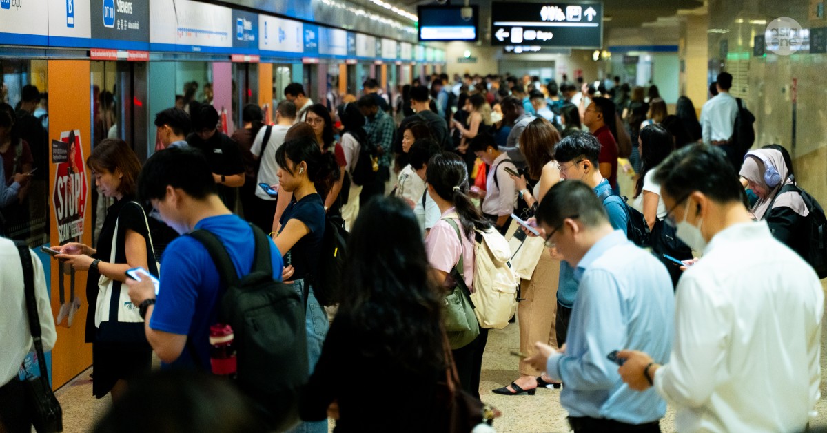 Commuters waiting on a crowded platform