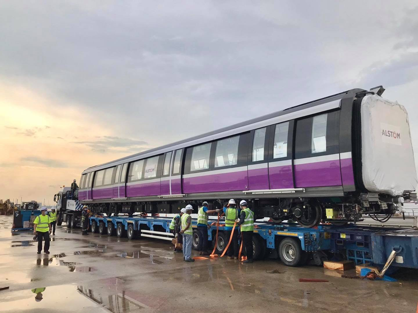Train moving through an industrial rail yard